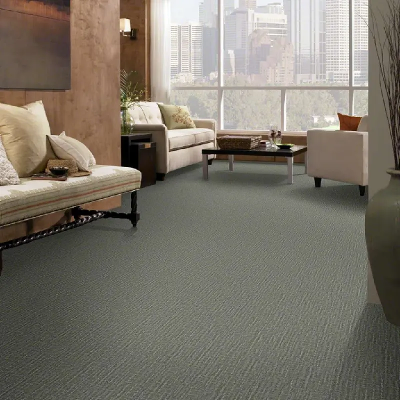 Living room with gray textured carpet, beige sofas, wooden coffee table