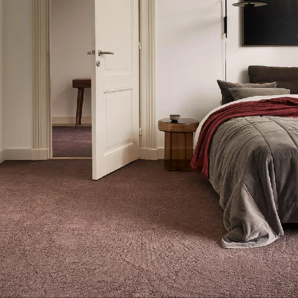 Mauve plush carpet in a modern bedroom.