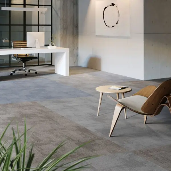 Modern office with gray luxury vinyl tile flooring and minimalist furniture