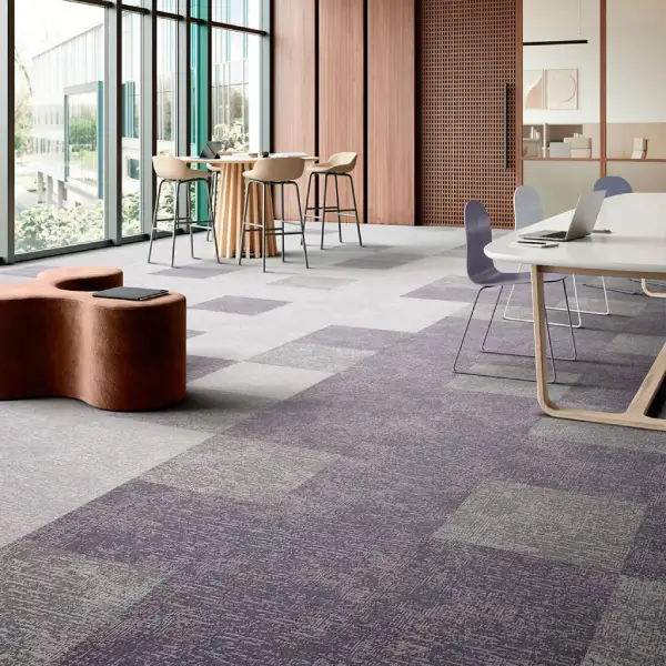 Modern office with purple and grey checkered carpet tiles.