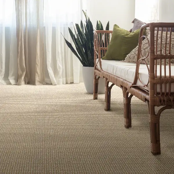 textured nylon carpet with a subtle grid pattern covers the floor of a bright room